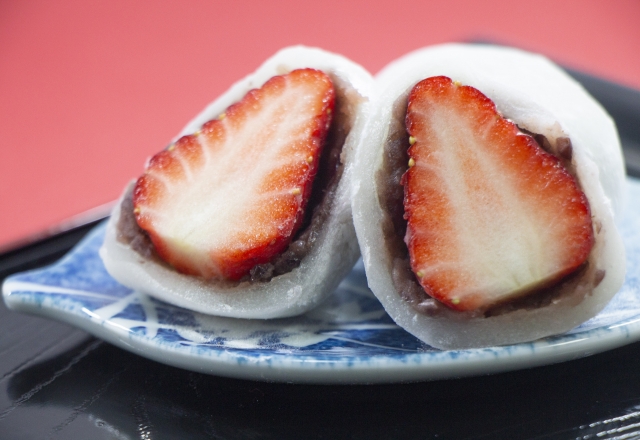 Ichigo Daihuku, a soft rice cake with sweet bean paste and a strawberry ...