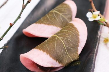 Sakuramochi, cherry-colored soft rice cakes wrapped by cherry leaves
