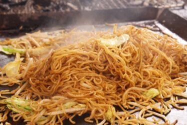 Yakisoba, stir-frying Chinese noodles with pork, seafood, and vegetables